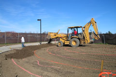 Bulldozer clears the pathways during construction of Sam Tubiolo's public art project, Evidence of Life. 