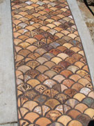 Detail image of handmade tiles at Mace Park in Davis.