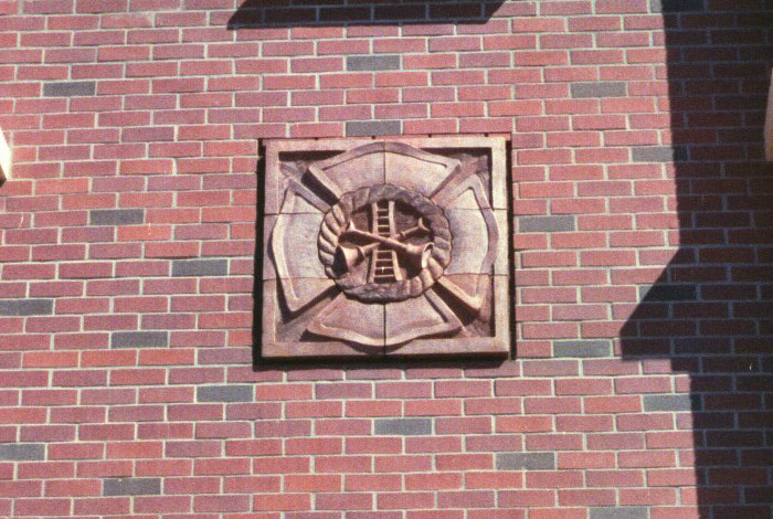 Protecting the Community tile detail with ladder and horn motif.