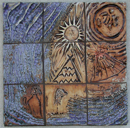 Ceramic handmade tile mural with volcanoe and sun motif at the Safe Harbor Crisis House in Woodland, CA.